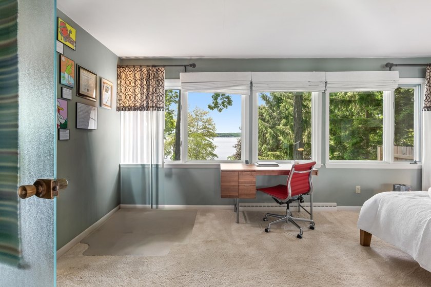 This 4-bedroom, 3-bath midcentury lake home offers 100 feet of - photo 29