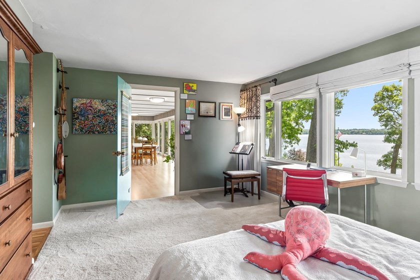 This 4-bedroom, 3-bath midcentury lake home offers 100 feet of - photo 30