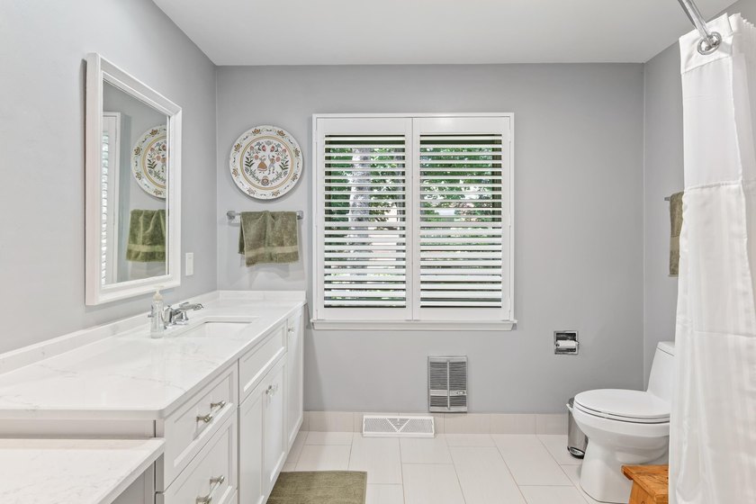 This 4-bedroom, 3-bath midcentury lake home offers 100 feet of - photo 33