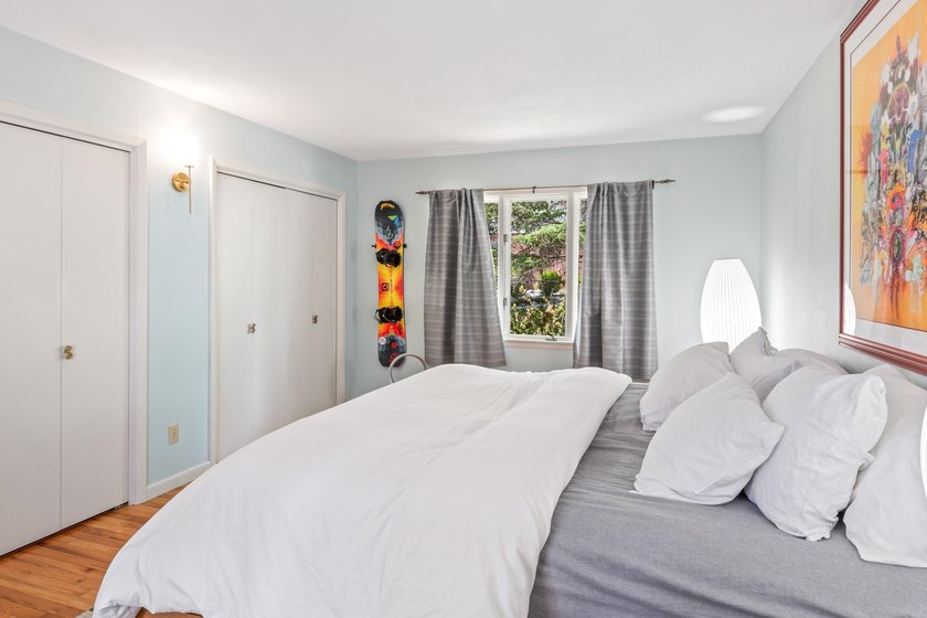 This 4-bedroom, 3-bath midcentury lake home offers 100 feet of - photo 40