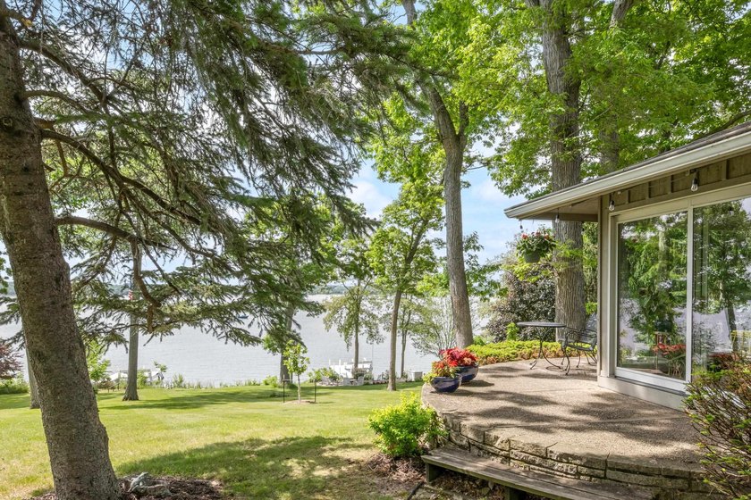 This 4-bedroom, 3-bath midcentury lake home offers 100 feet of - photo 48