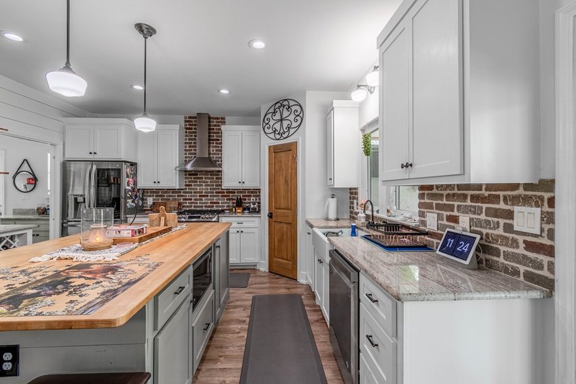 Charming Coastal Farmhouse on 1/2 Acre with Pond in Coveted - photo 6