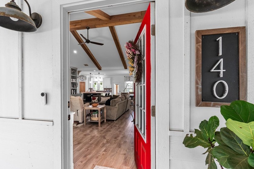 Charming Coastal Farmhouse on 1/2 Acre with Pond in Coveted - photo 9