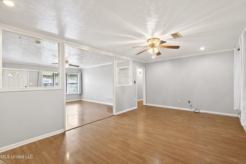This well-maintained 3-bedroom brick home in Long Beach offers a - photo 11
