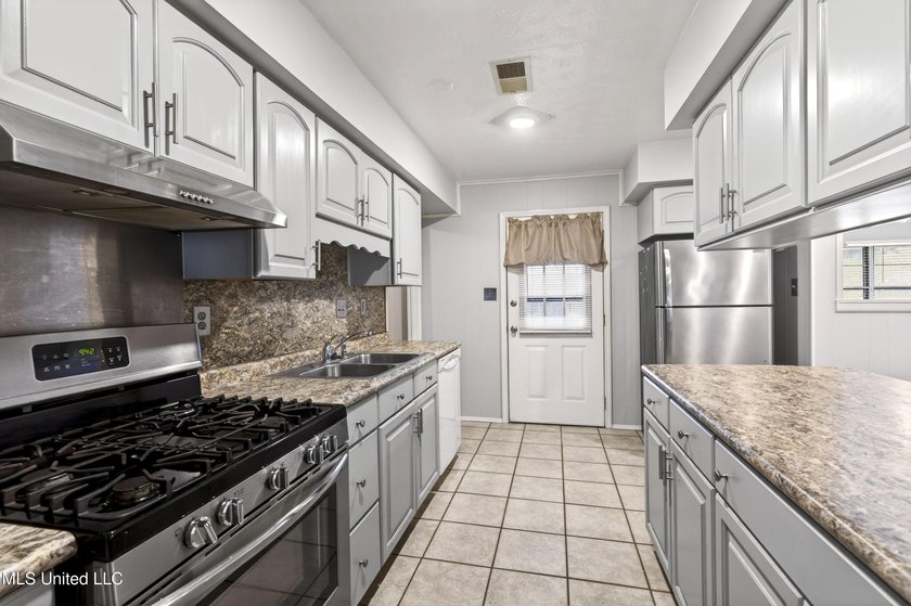 This well-maintained 3-bedroom brick home in Long Beach offers a - photo 14