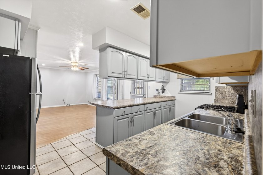 This well-maintained 3-bedroom brick home in Long Beach offers a - photo 15