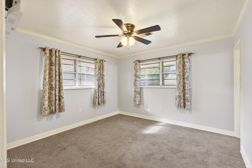 This well-maintained 3-bedroom brick home in Long Beach offers a - photo 16