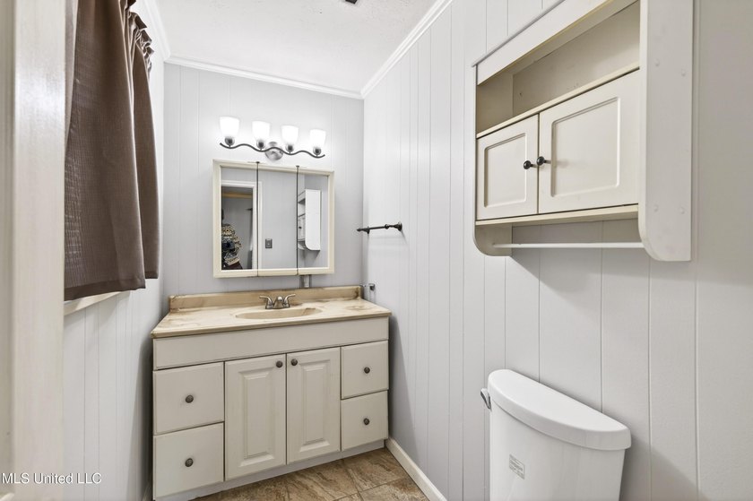 This well-maintained 3-bedroom brick home in Long Beach offers a - photo 18