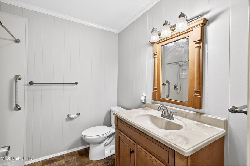 This well-maintained 3-bedroom brick home in Long Beach offers a - photo 22