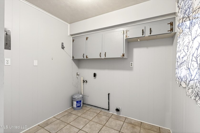 This well-maintained 3-bedroom brick home in Long Beach offers a - photo 24