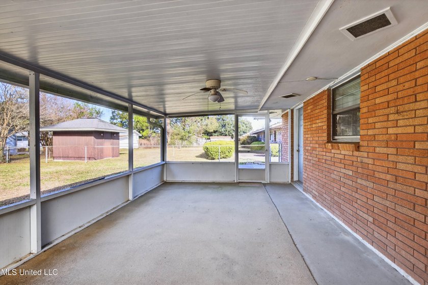 This well-maintained 3-bedroom brick home in Long Beach offers a - photo 26