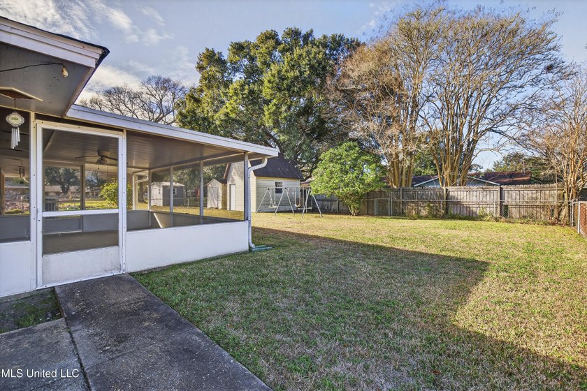 This well-maintained 3-bedroom brick home in Long Beach offers a - photo 31