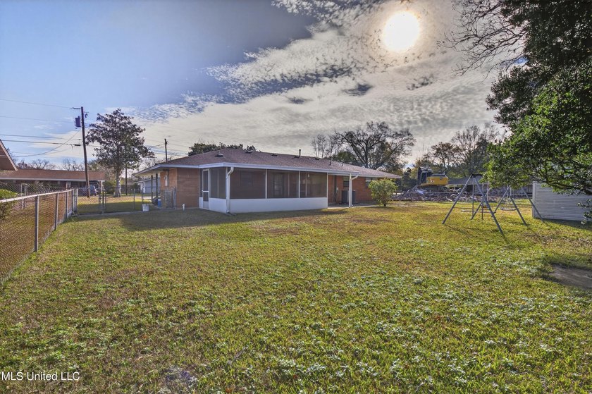 This well-maintained 3-bedroom brick home in Long Beach offers a - photo 32