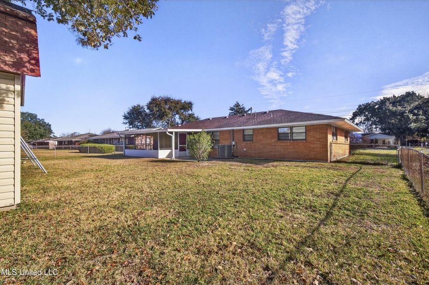 This well-maintained 3-bedroom brick home in Long Beach offers a - photo 34