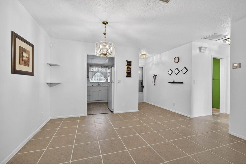 Welcome home to this inviting residence featuring tile floors &amp; - photo 8