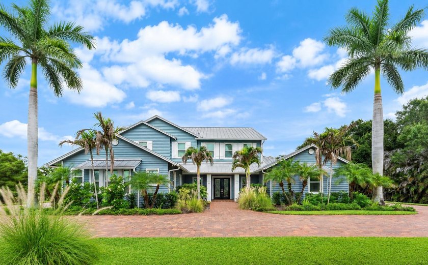 Situated on nearly 2 acres in the gated golf and equestrian - photo 2