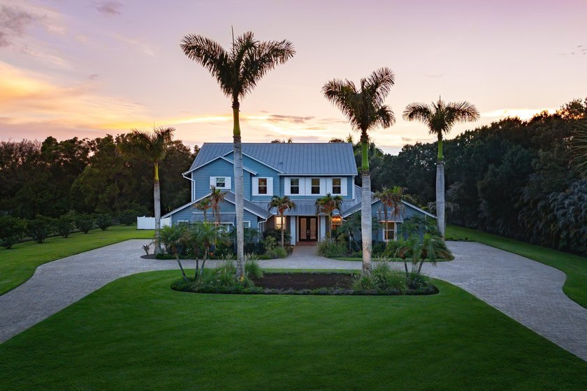 Situated on nearly 2 acres in the gated golf and equestrian - photo 3