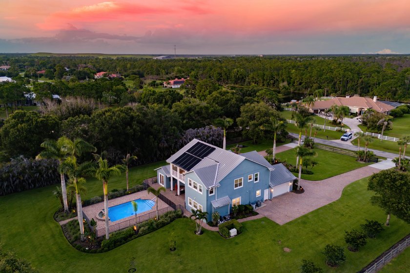 Situated on nearly 2 acres in the gated golf and equestrian - photo 4