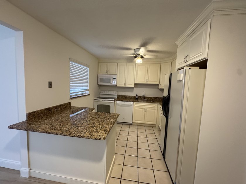 Discover practical living in this charming single-story - photo 4