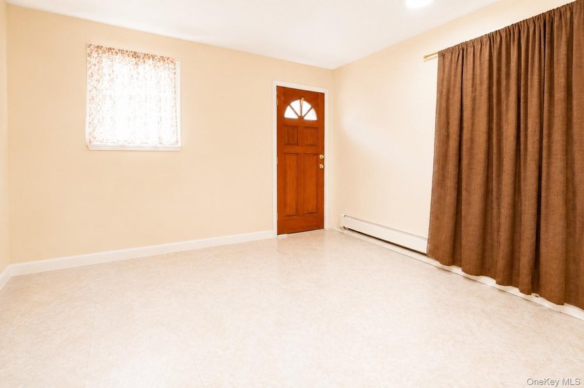 After 45 years, this charming semi-detached brick townhouse is - photo 12