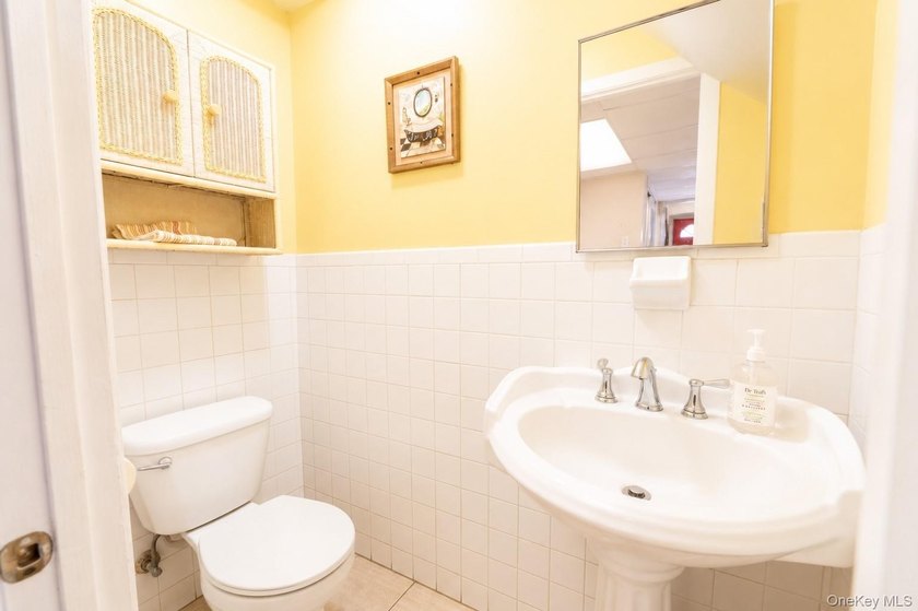 After 45 years, this charming semi-detached brick townhouse is - photo 13
