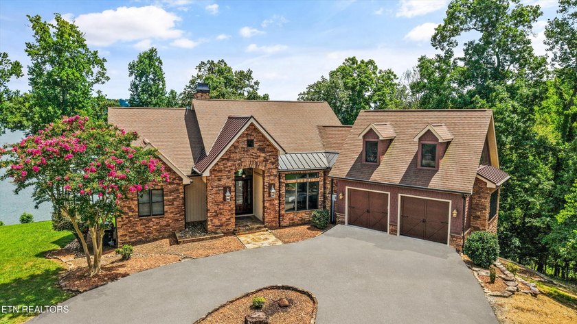 Experience luxury lakefront living in this exceptional 5-bedroom - photo 2