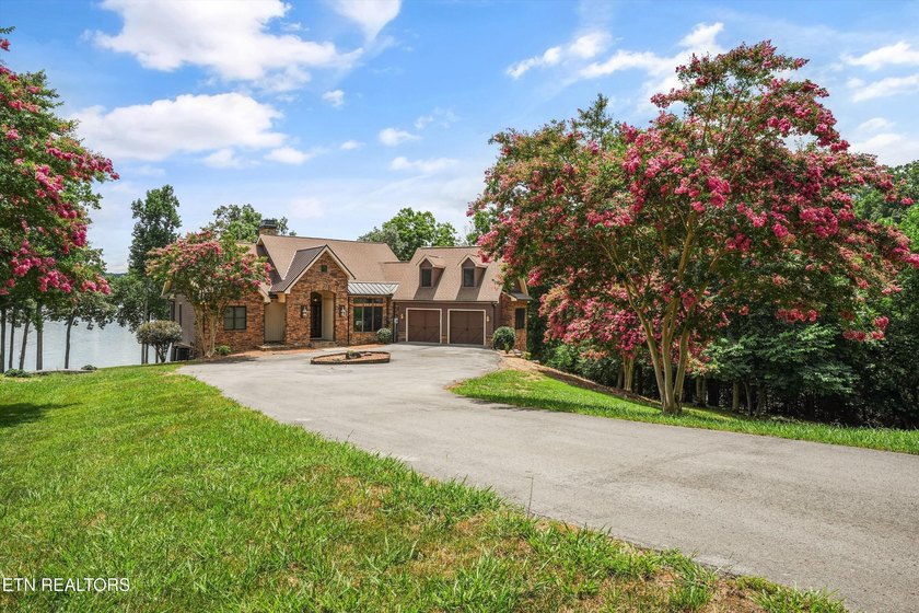 Experience luxury lakefront living in this exceptional 5-bedroom - photo 3
