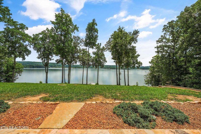 Experience luxury lakefront living in this exceptional 5-bedroom - photo 10