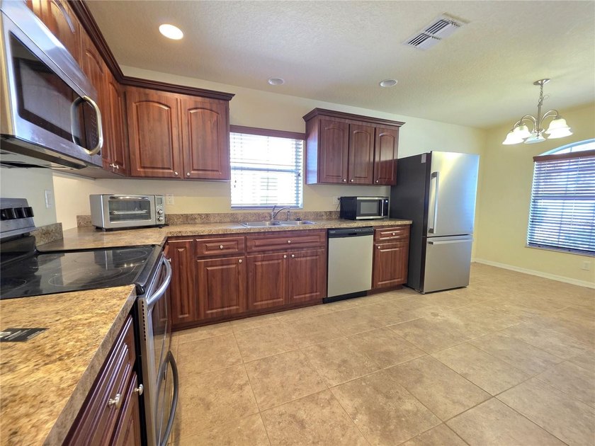 Sand Ridge Community 3 Bedroom 2 Full Baths And A 2 Car Garage- - photo 11
