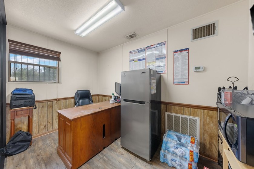 Commercial property offering a versatile space suitable for - photo 12