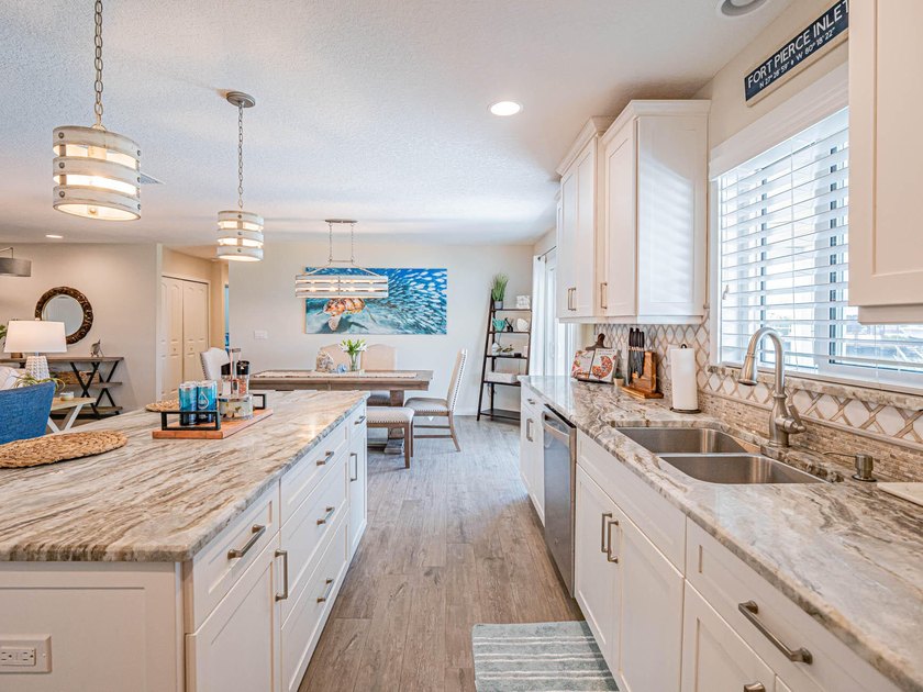 Welcome to this waterfront single-story residence in Coral Cove - photo 3