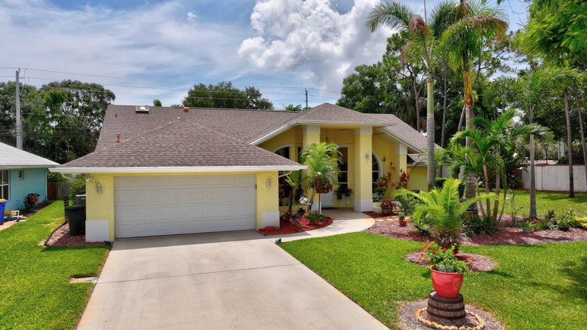 Palm trees sway over your private, screened pool at this move-in - photo 3