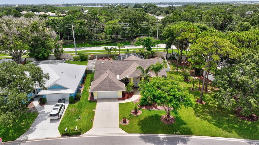 Palm trees sway over your private, screened pool at this move-in - photo 5