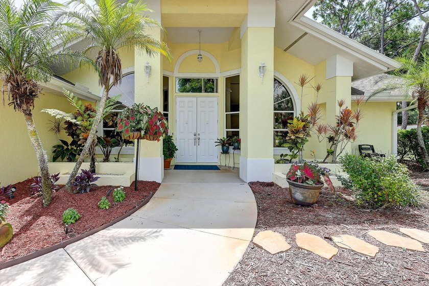Palm trees sway over your private, screened pool at this move-in - photo 6