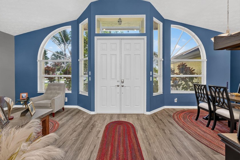 Palm trees sway over your private, screened pool at this move-in - photo 7