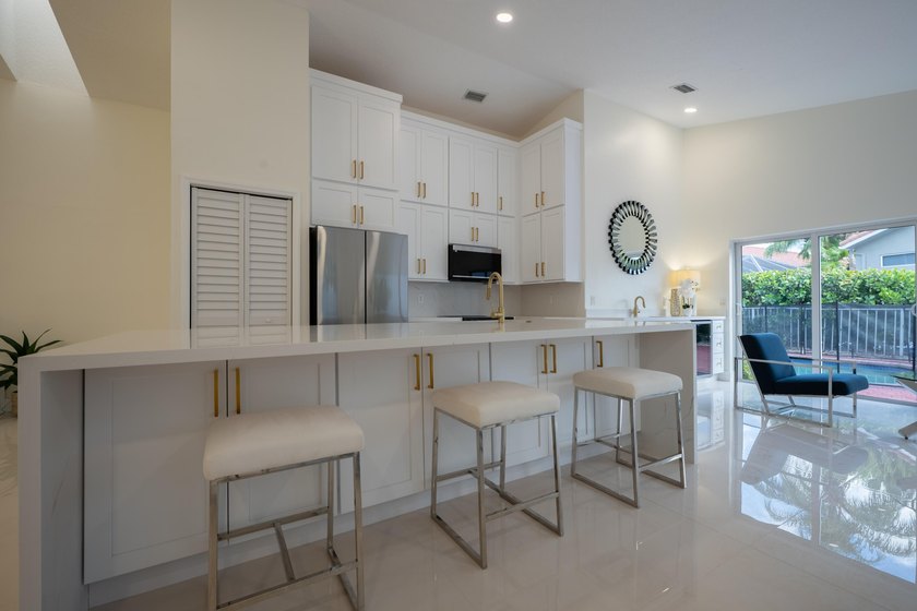 Welcome to this 3/2 house in the central-Boca neighborhood of - photo 2