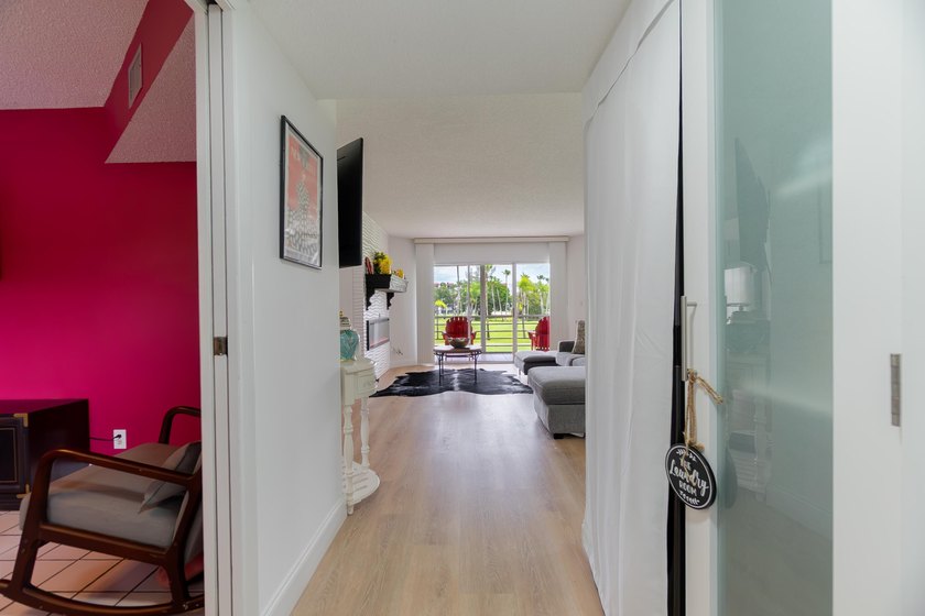 Welcome to this spacious 2-bedroom, 2-bath condominium located - photo 3