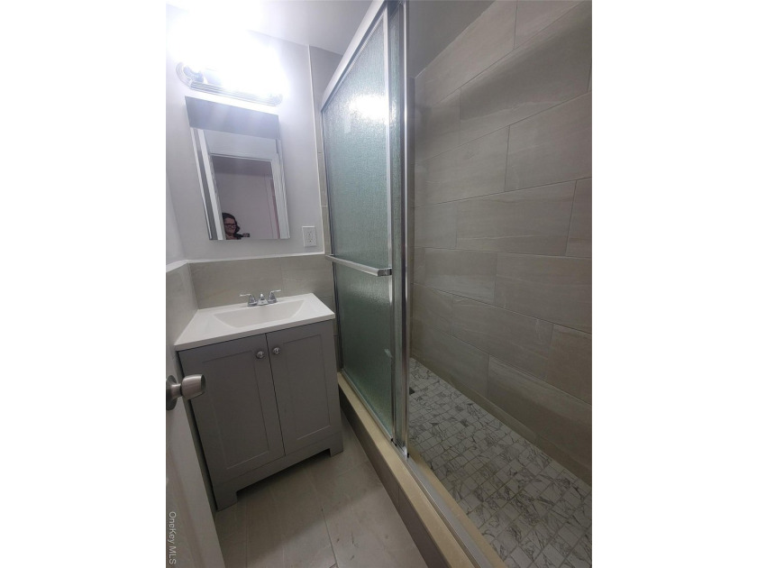 THIS UNIT HAS A SPECTACULAR VIEW OF THE CITY SKYLINE, LOCATED IN - photo 12