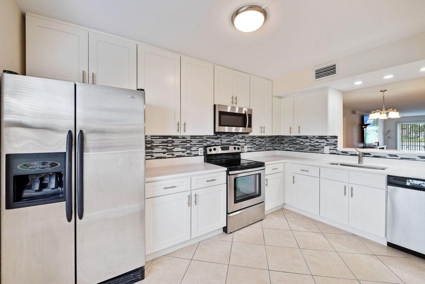 Rarely available first-floor corner unit in the highly - photo 3