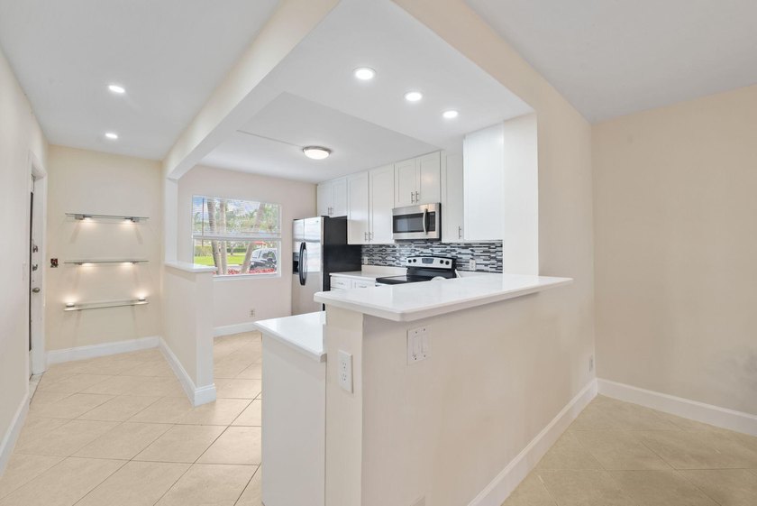 Rarely available first-floor corner unit in the highly - photo 4