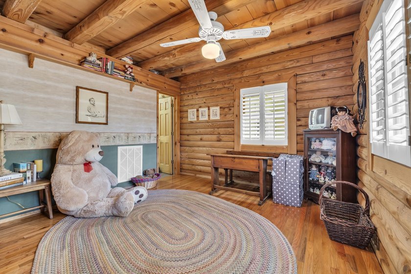 Situated beneath towering oak trees on a secluded one-acre - photo 24