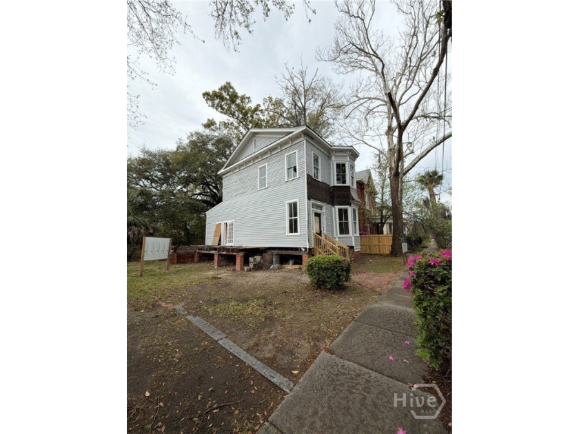 217 E 38th St is a completely gutted, two-story single-family - photo 3