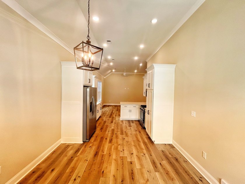 ONE LEVEL. MAPLE PLAN. This 2023 build has tons of upgrades - photo 4