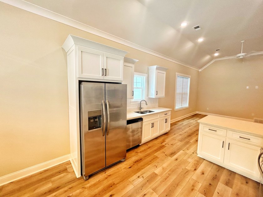 ONE LEVEL. MAPLE PLAN. This 2023 build has tons of upgrades - photo 5