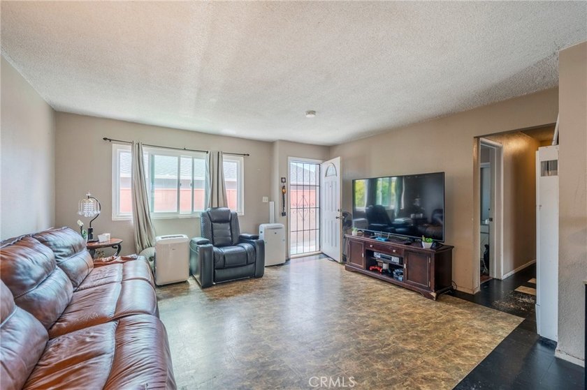 Well-maintained triplex featuring a desirable unit mix of one - photo 3