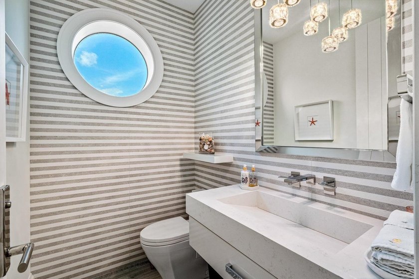 Welcome to this stunning 3-story townhouse in Ocean Ridge. This - photo 26