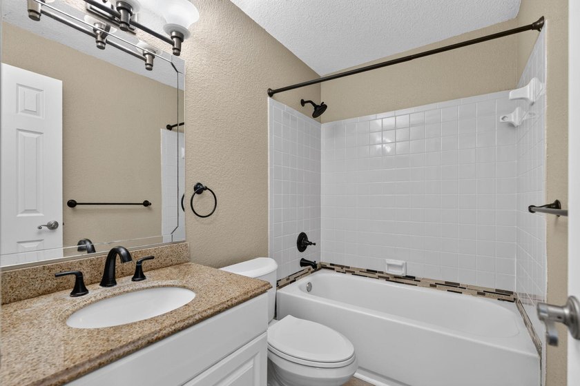 Welcome to this charming 3-bedroom, 2-bathroom CBS home situated - photo 12