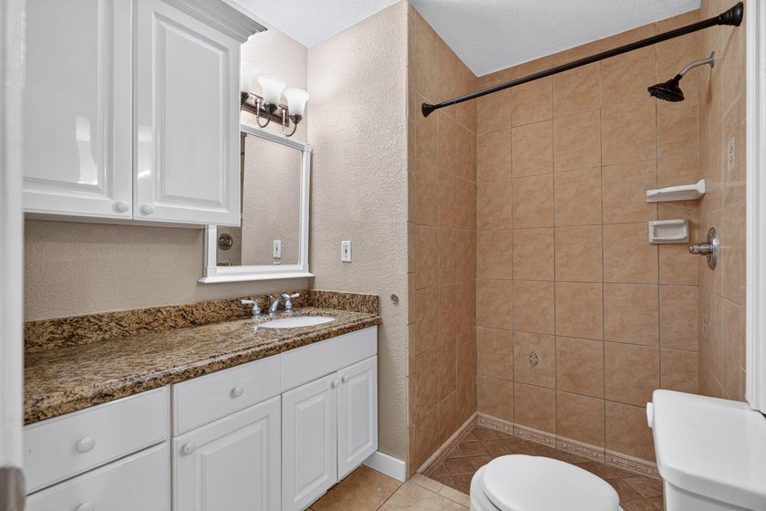Welcome to this charming 3-bedroom, 2-bathroom CBS home situated - photo 27