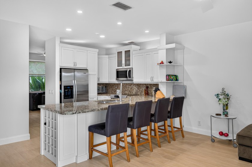 Welcome to this stunning waterfront residence nestled in The - photo 9