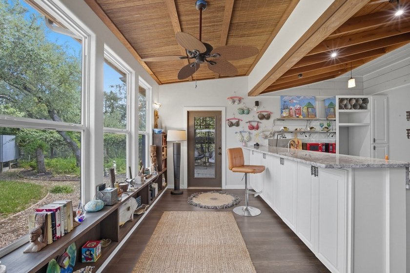 This one-of-a-kind coastal retreat blends island-style charm - photo 3